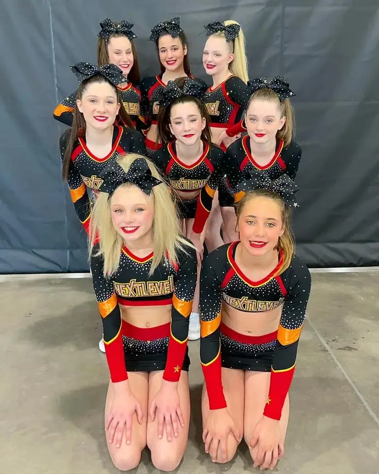 All-Star Cheer team alongside the USASF certification badge on the Next Level Athletics homepage