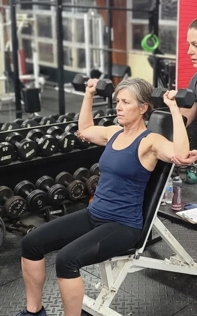 Personal training: coach working with a member at Next Level Fitness Moline